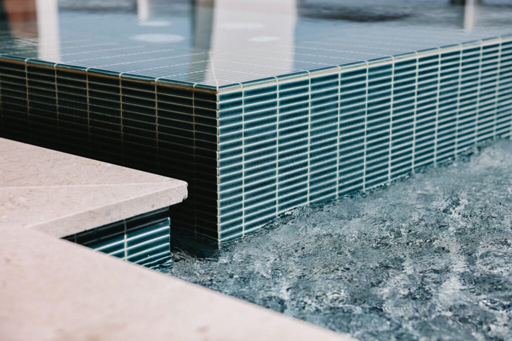 Pool tile and water detail maintained by Premier Pool Care 30A